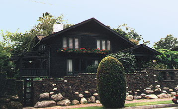 James W. Neill house 400 Arroyo View Drive, 1906. Originally built in 1903, In 1906 Neill remodelled the house in Craftsman style with the addition of the porch, expressed timbers, a massive boulder and clinker brick wall, pergola and the conversion to the natural shingle from its original clapboard siding.